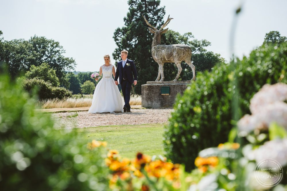 Bride and groom walking the grounds at Gosfield Hall