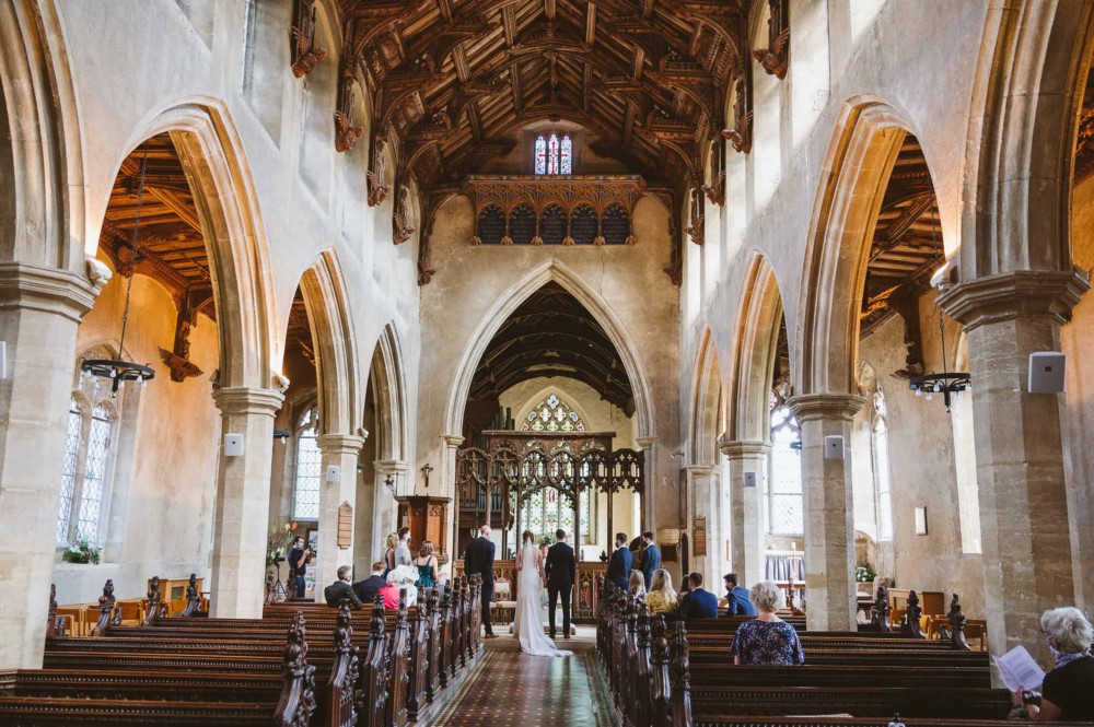 Wide photo of the church wedding ceremony taking place