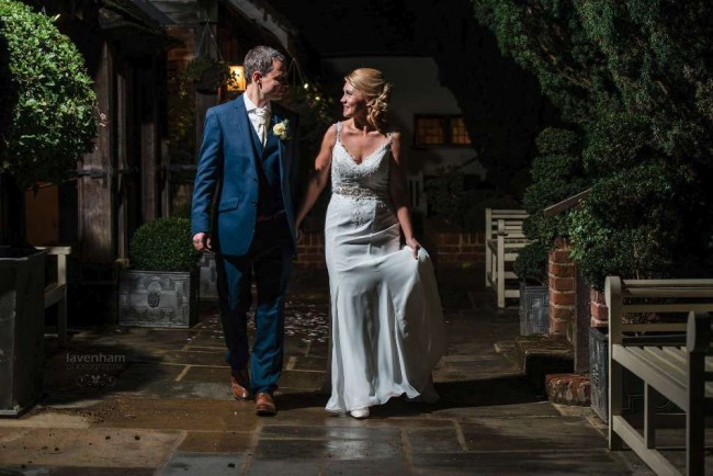 Bride and groom at Swan Hotel, walking, night photo with remote lighting