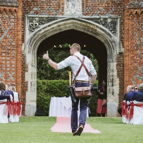 Ben Brown of Lavenham Photographic photographing a wedding ceremony
